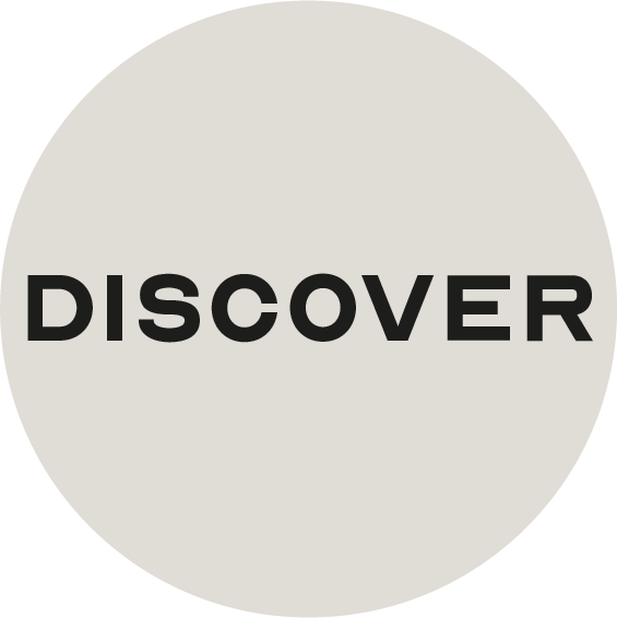 Black uppercase word 'DISCOVER' centered on a light gray circular background.