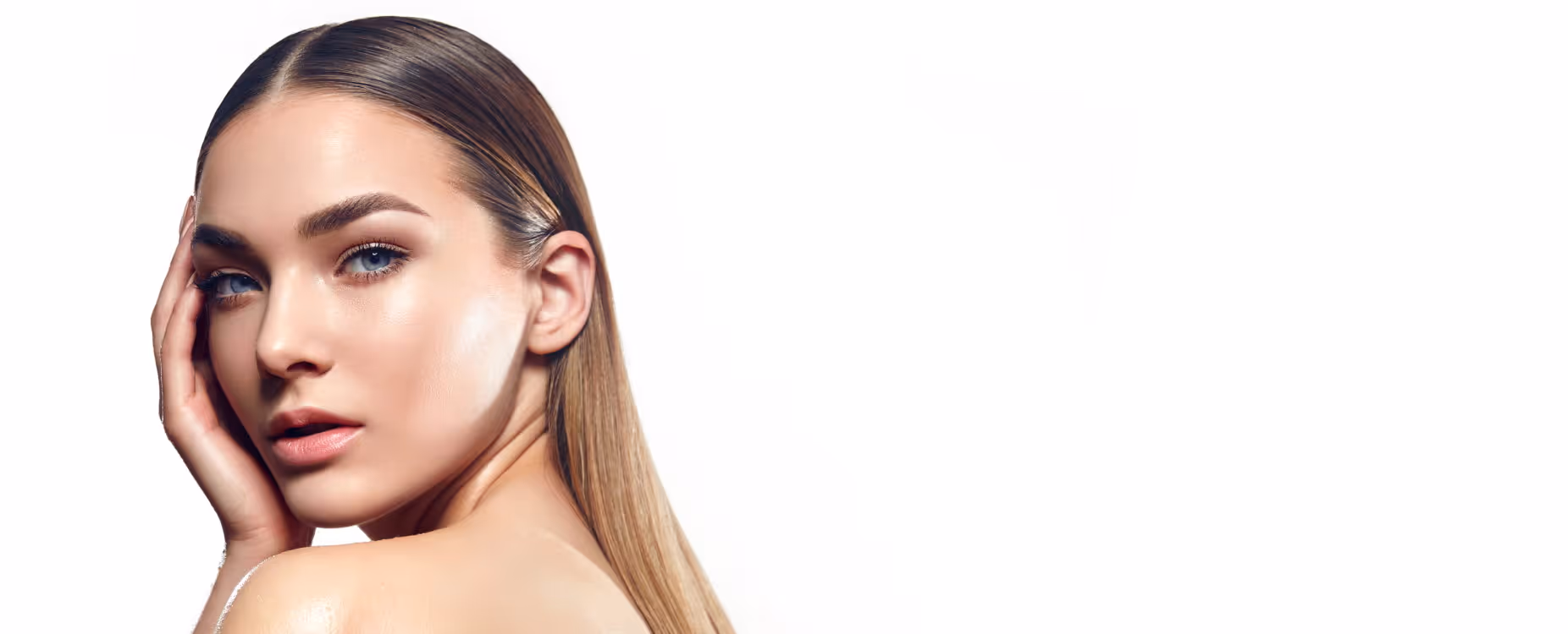 A woman with long hair looks at the camera, resting her hand on her face against a white background.