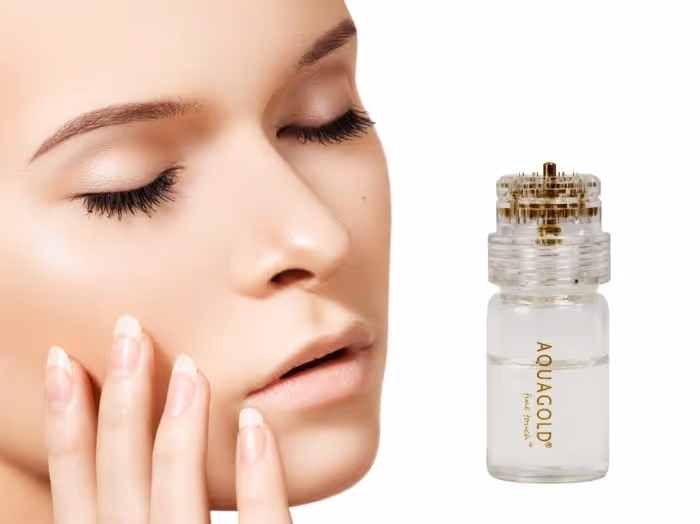 A close-up of a woman touching her face, next to an Aquagold skincare bottle.