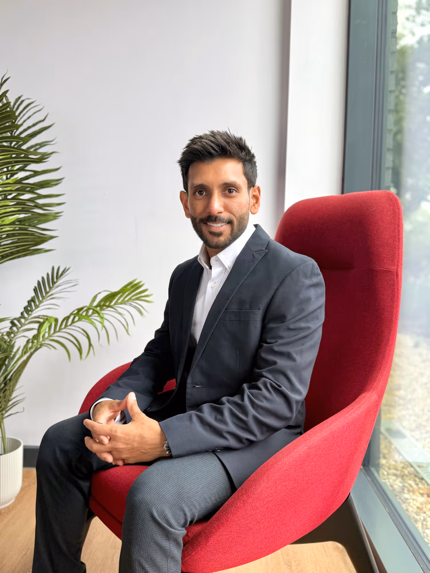 a man sitting in a red chair