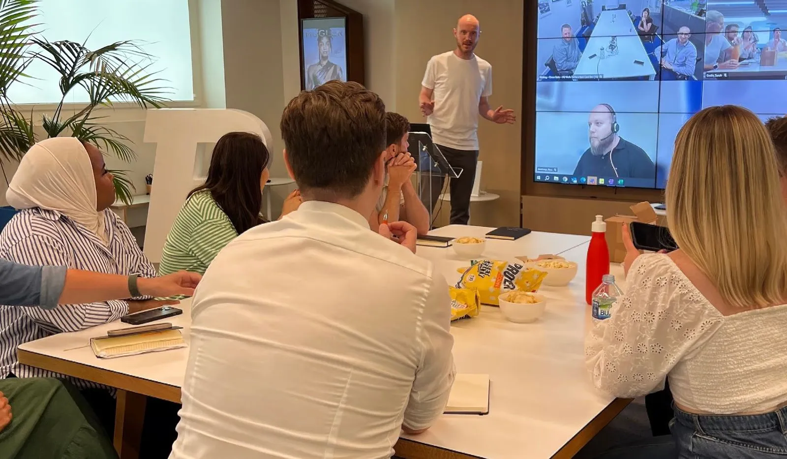 Bauer Media Colleagues attending a presentation in the office