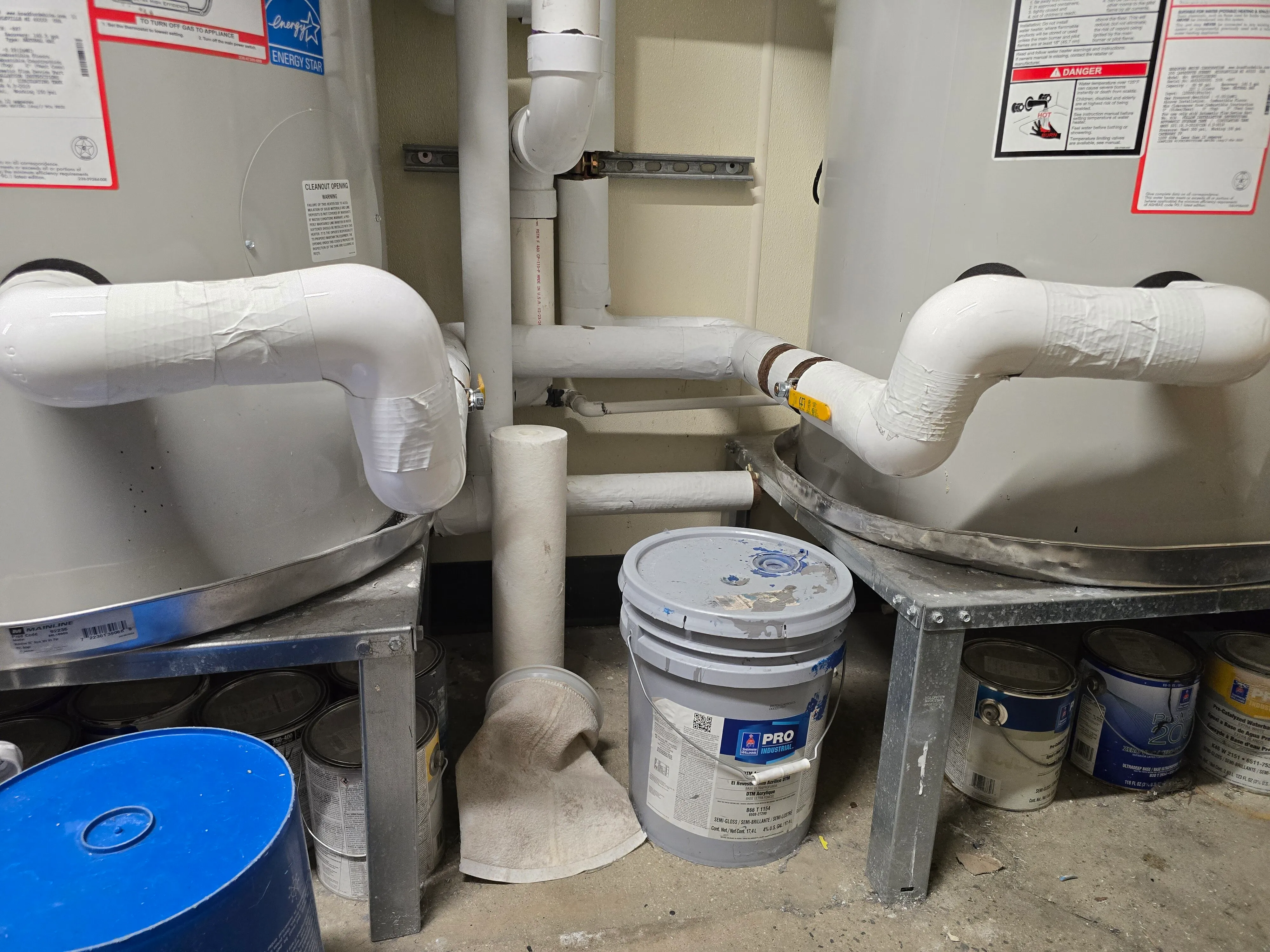 Tankless water heater installation in Murrieta, CA, with units and pipes being set up.