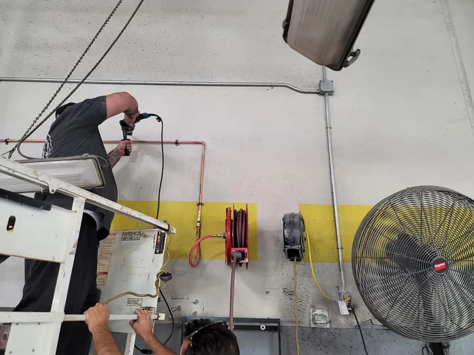 Emergency plumbing repairs in Murrieta, CA, with a technician working on the pipes