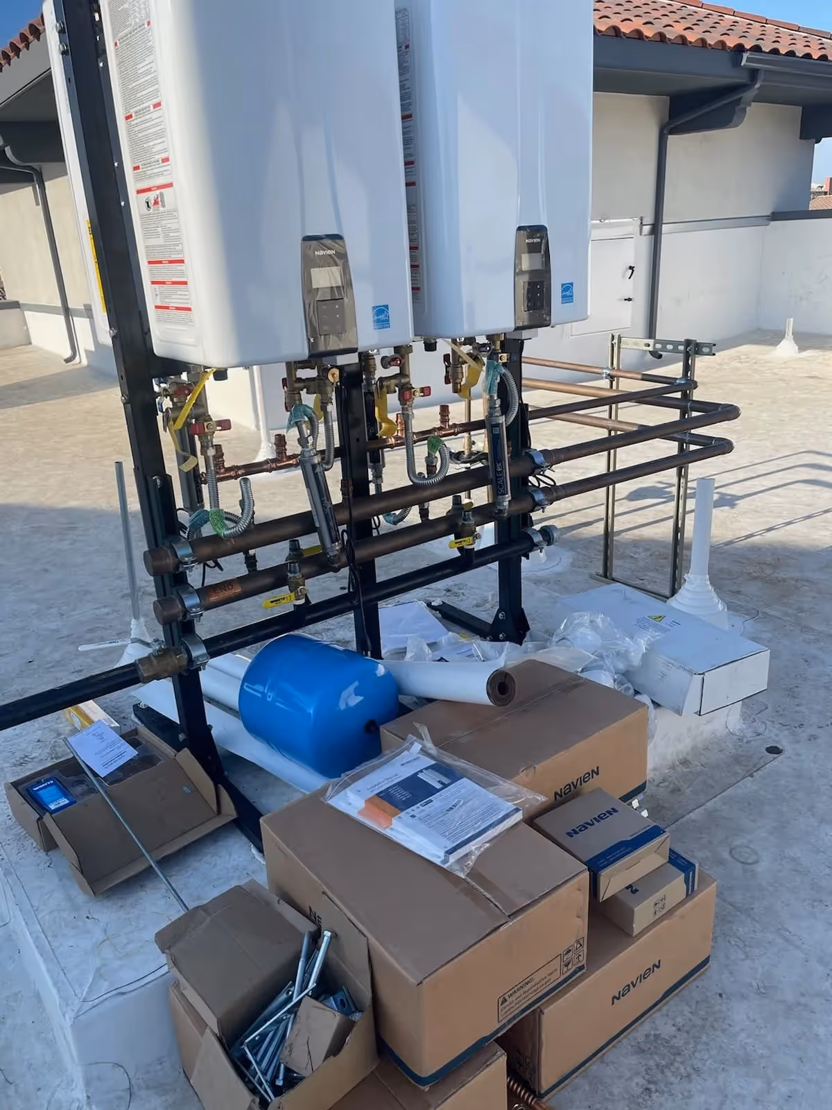 Gas line services in Murrieta, CA, with technicians installing tankless water heaters and connecting gas lines.