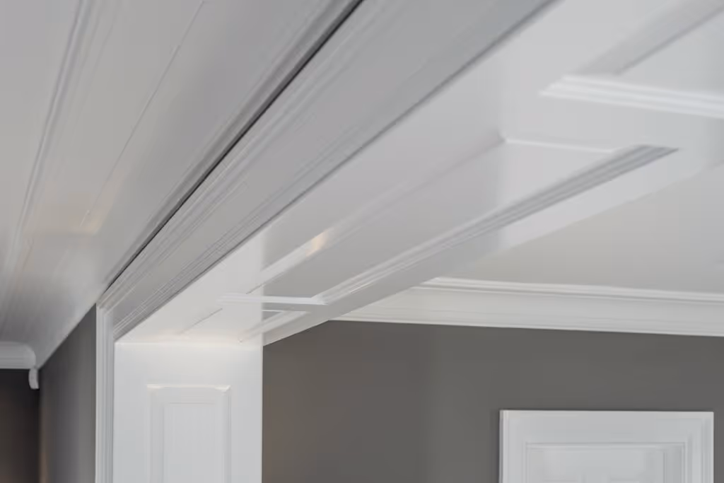 Airless paint spraying gives smooth coverage on overhead surfaces.