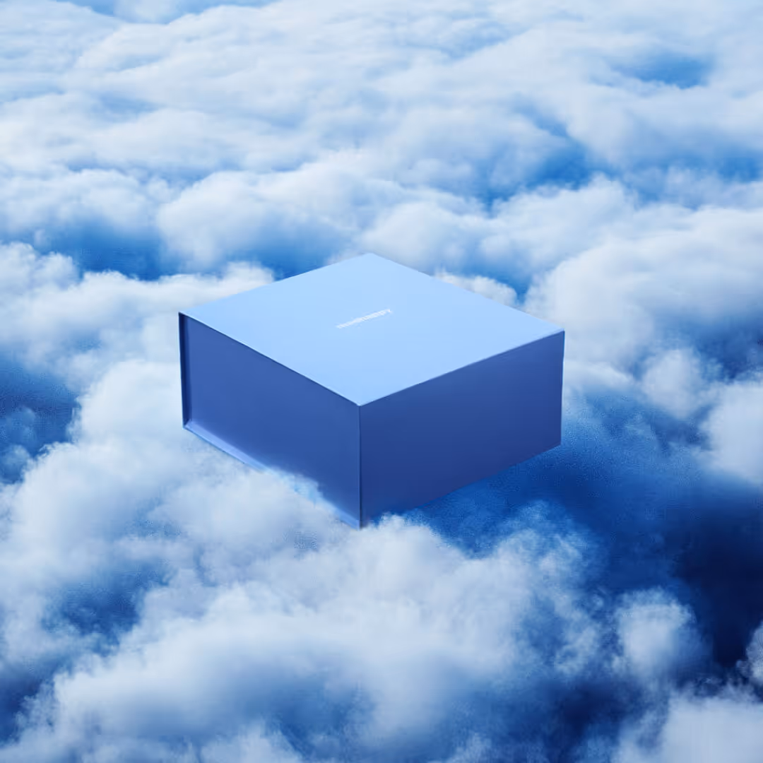 Blue rectangular box floating above dense white clouds in a sky scene.