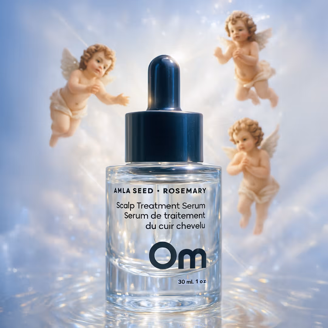 Glass bottle of Om Amla Seed and Rosemary Scalp Treatment Serum with angel cherubs floating in the background.