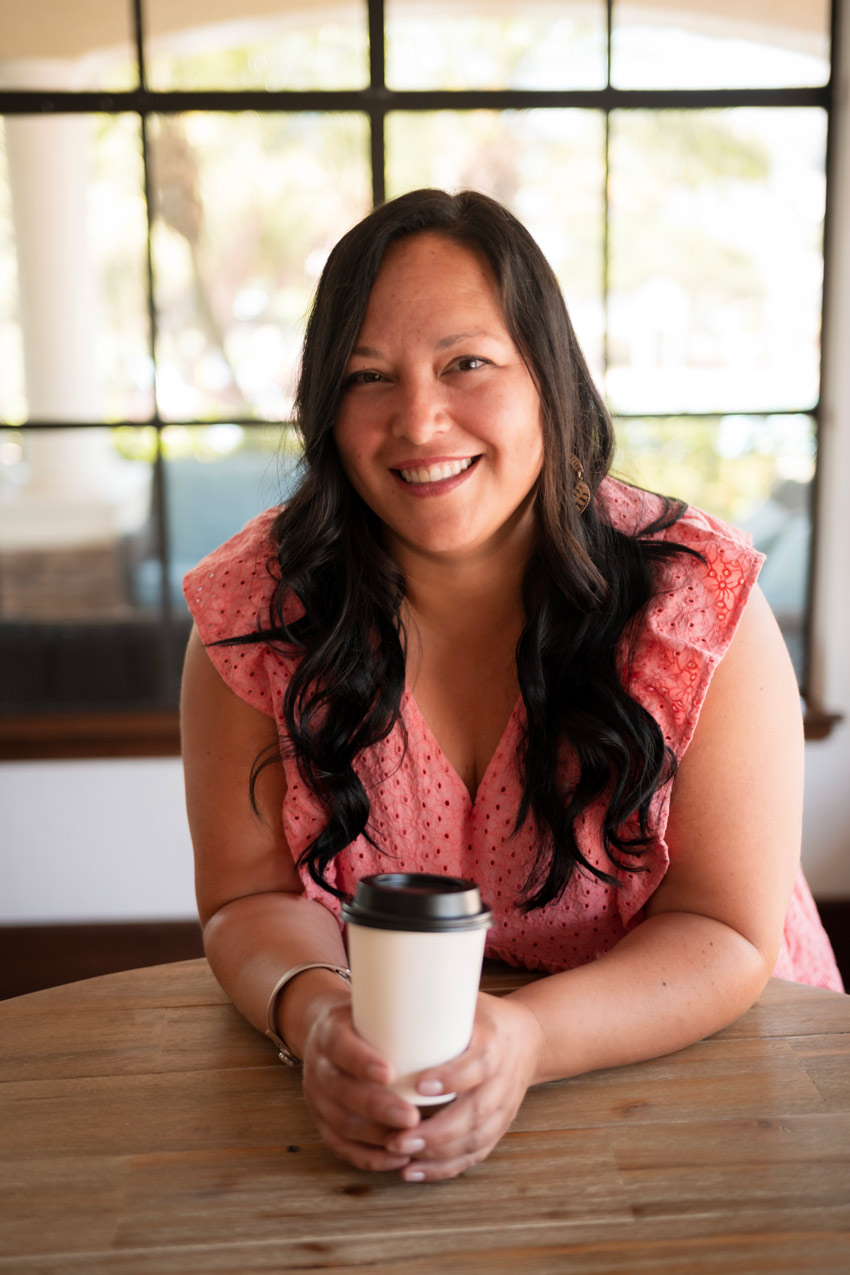 Owner of Sunkissed Brew smiling while holding a coffee cup in Tampa Bay