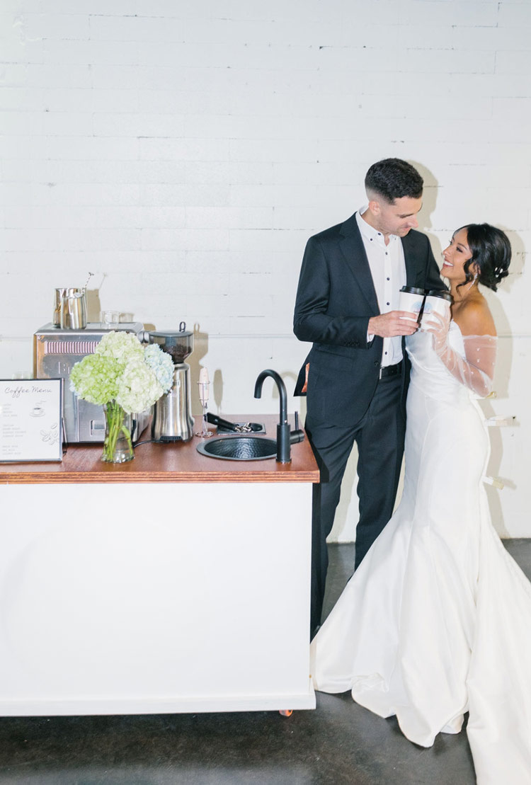 Bride and groom enjoying coffee at a Sunkissed Brew mobile coffee cart during their wedding reception