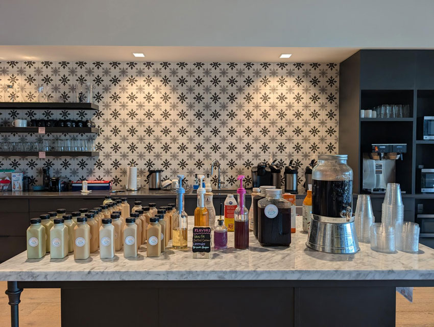 coffee bar setup with bottled lattes and syrup station by Sunkissed Brew in Tampa Bay