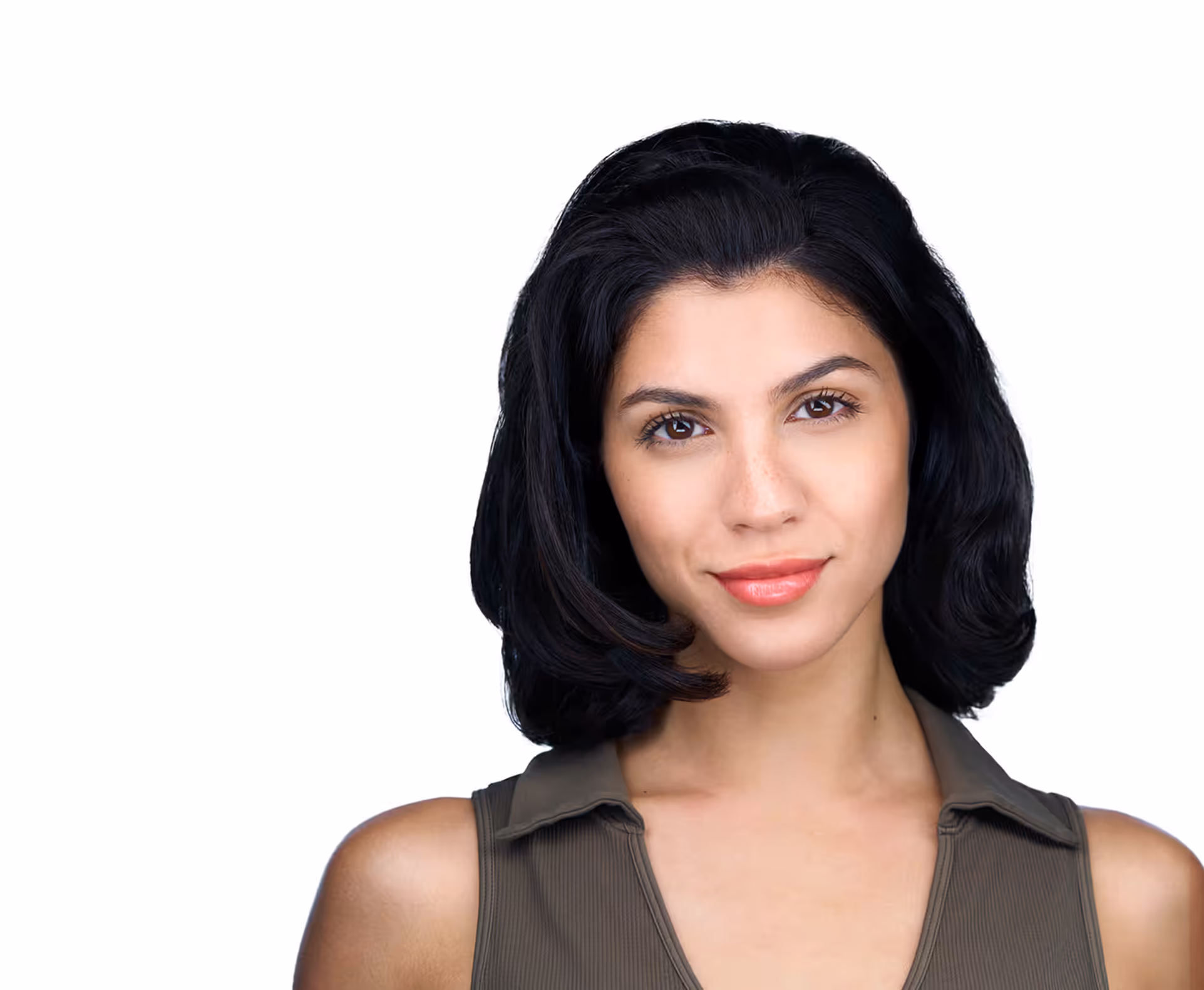 Young woman with smooth dark hair and olive sleeveless top smiling against white background.