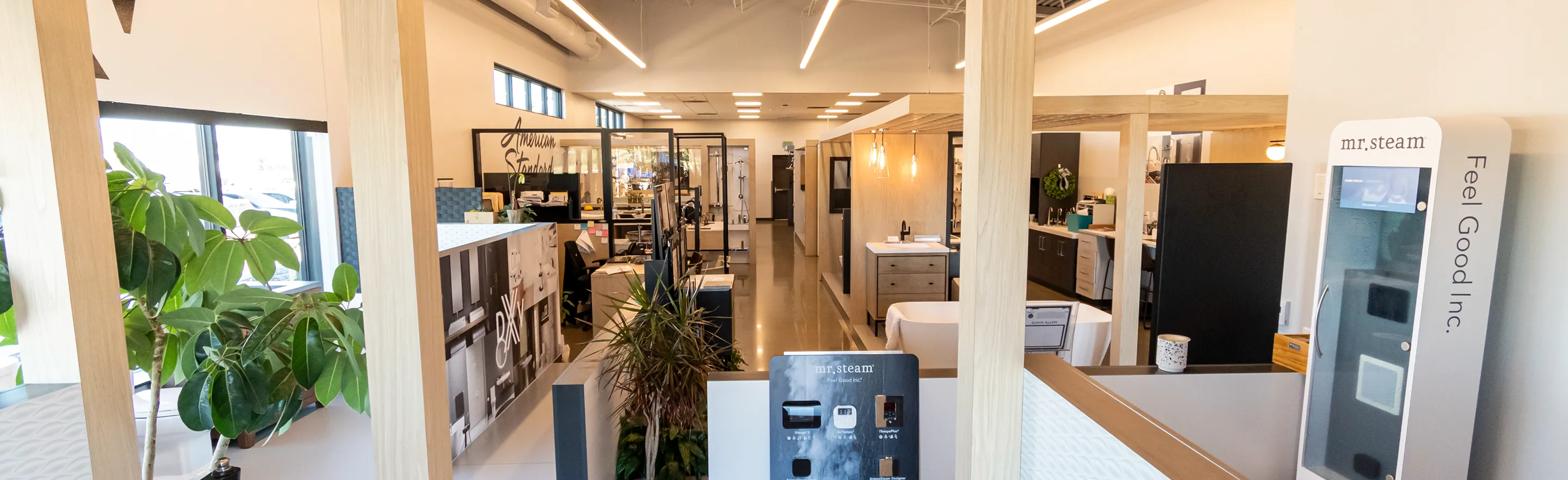 Wide view of The Water Closet showroom interior displaying multiple fixture stations and design areas.