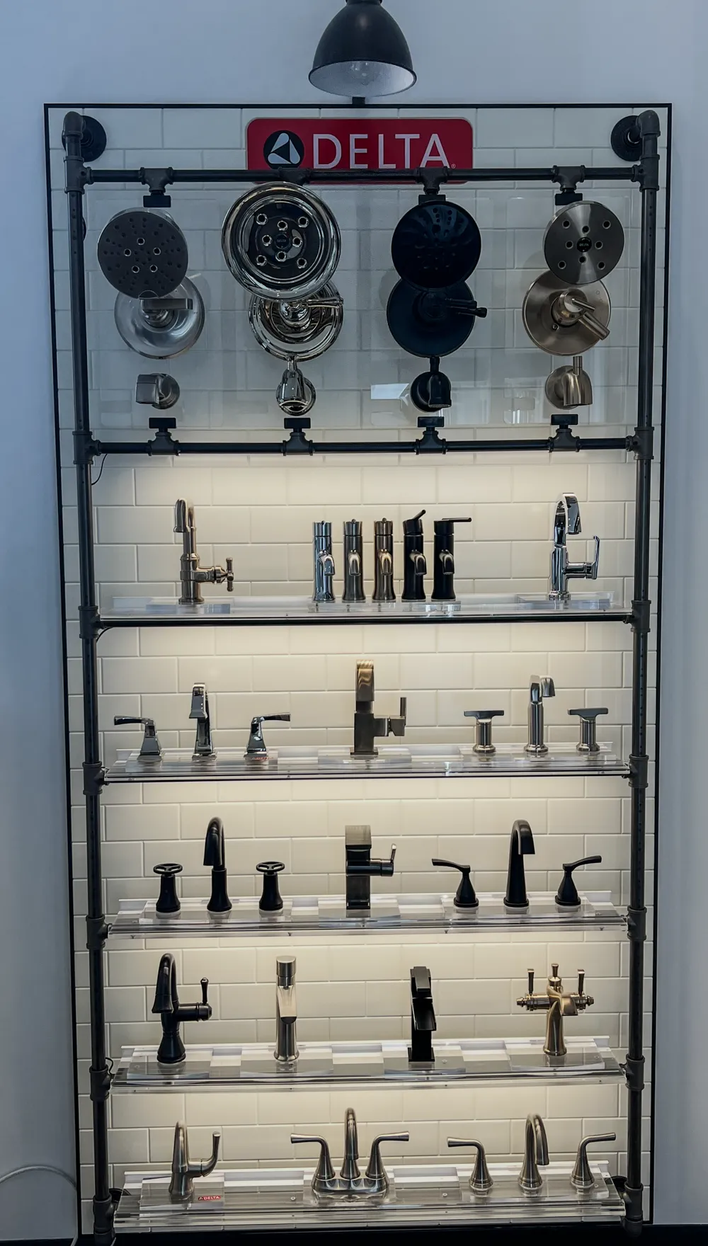 Shower and faucet accessory display panel in Bozeman showroom