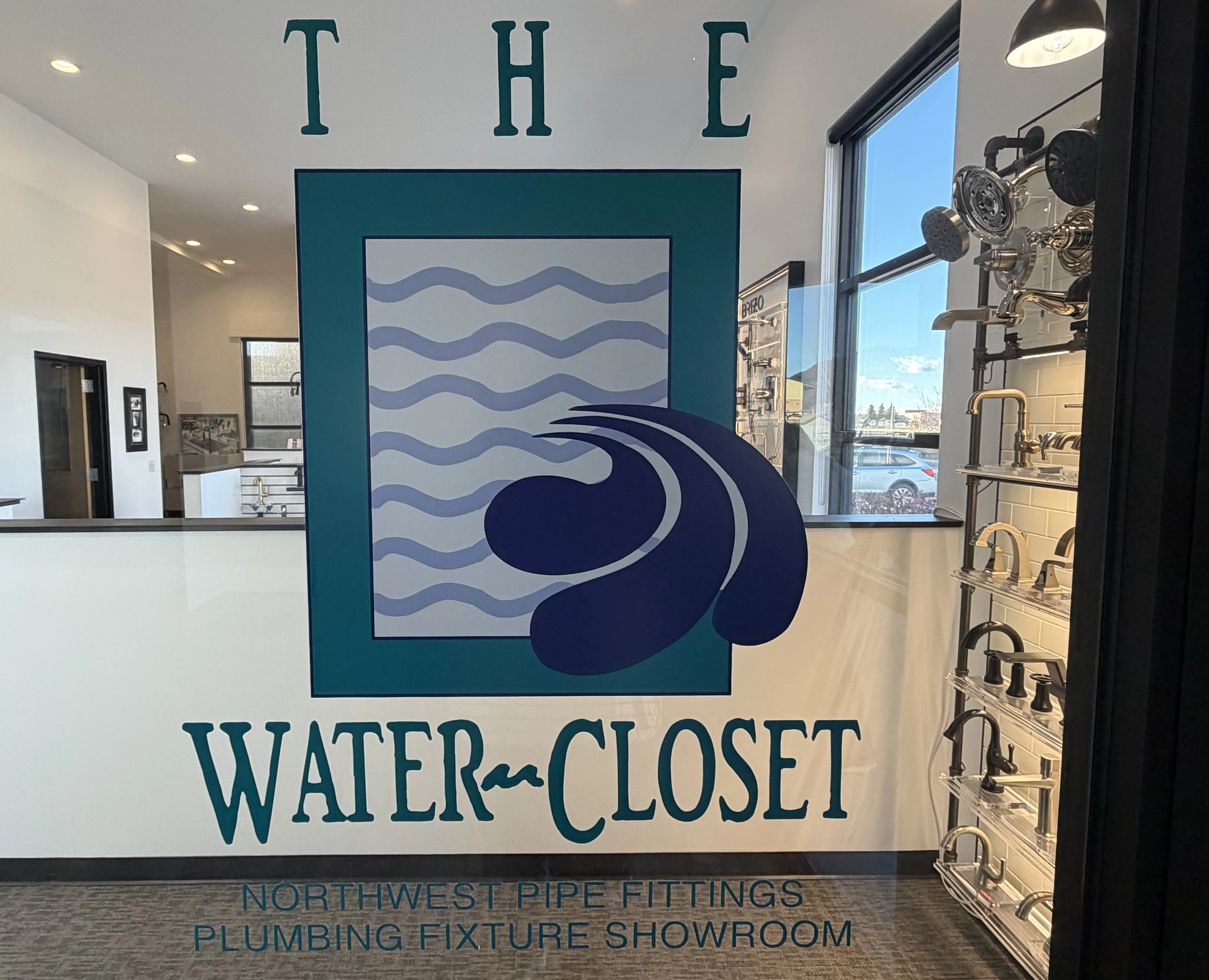 The Water Closet Bozeman showroom sign and logo display