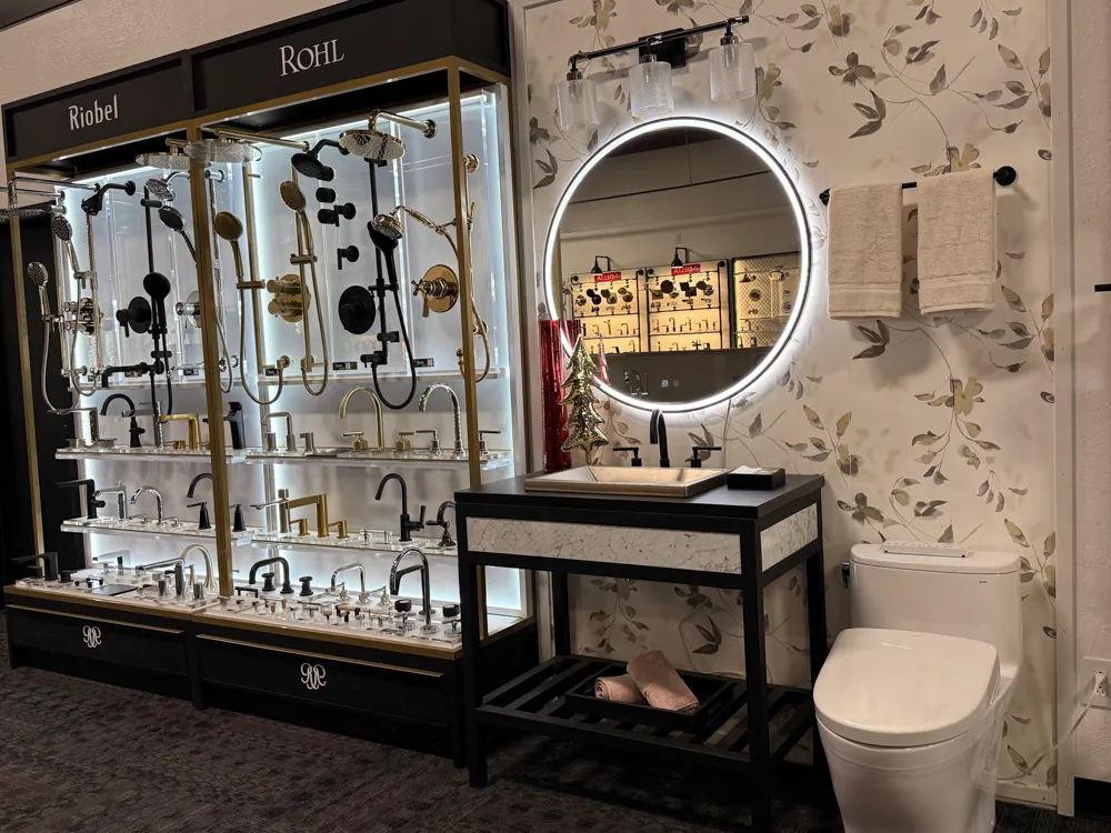 Luxury bathroom fixture wall featuring toilets and sinks in Missoula showroom
