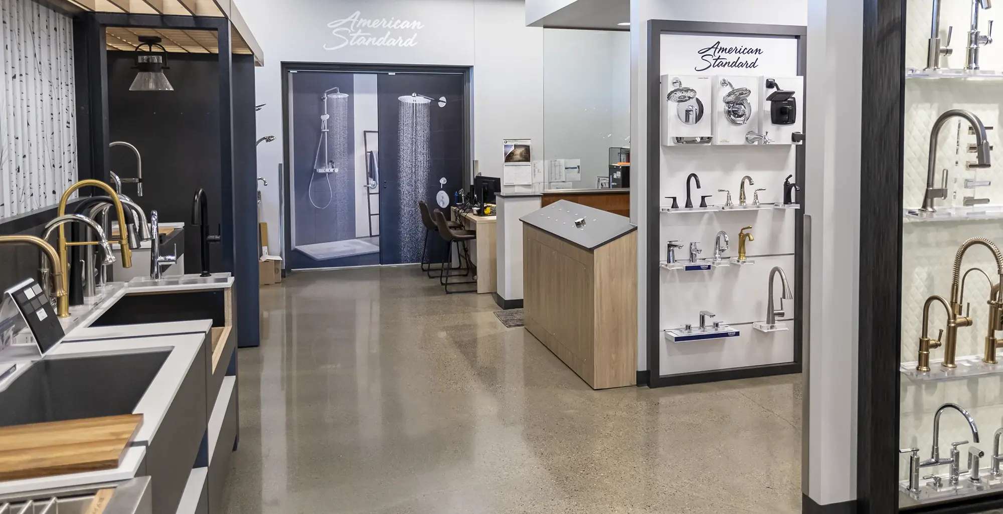 Wide interior view of The Water Closet showroom featuring faucet and shower displays
