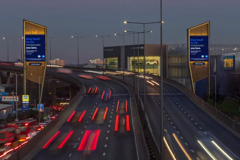American Express's Storm advertisement at night with lots of motor vehicles driving by