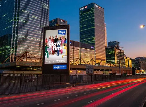 A Magic FM campaign displayed on premium large format digital screen outside Billingsgate market.