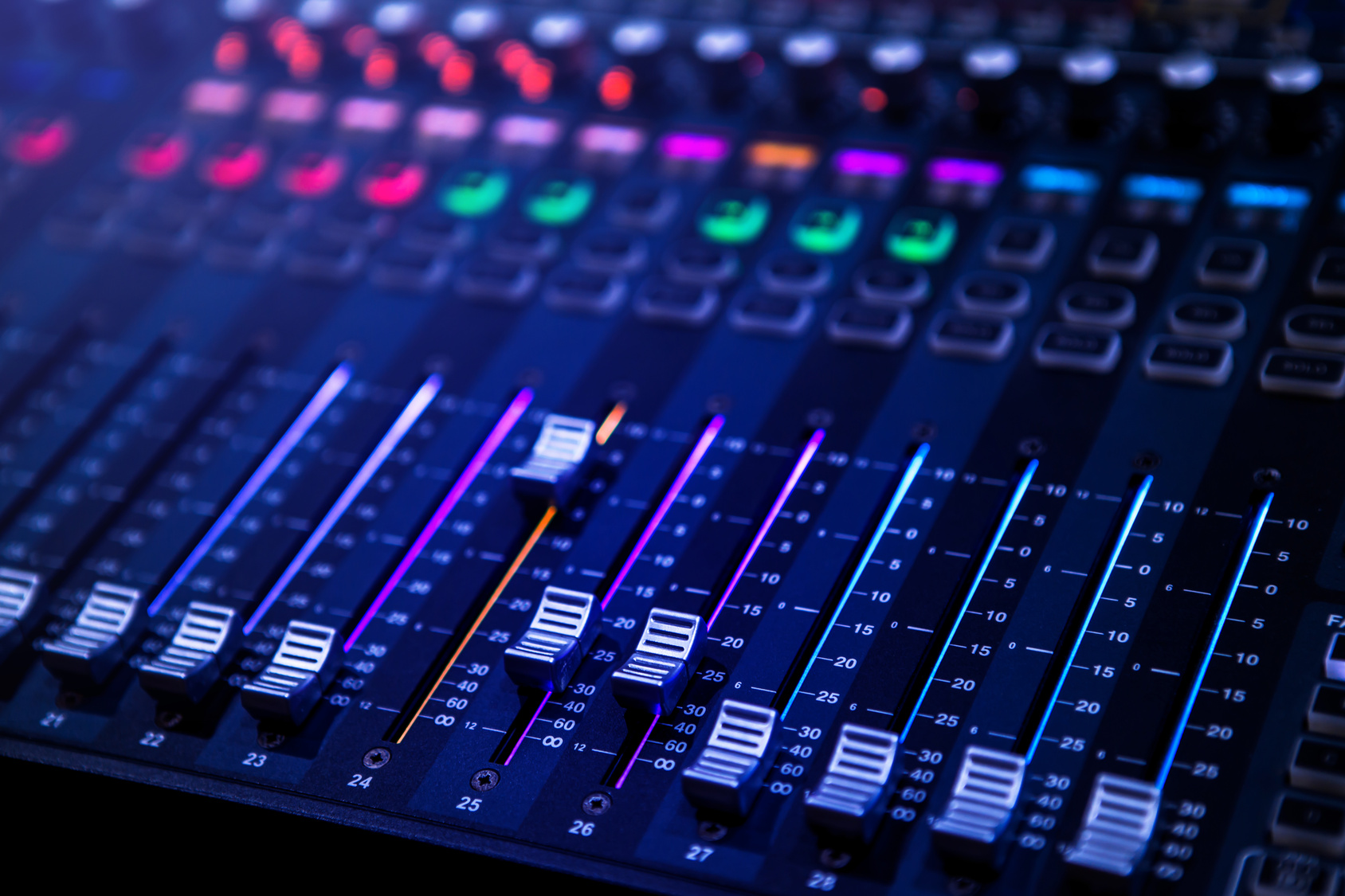 Professional audio mixing console faders used for live event sound engineering