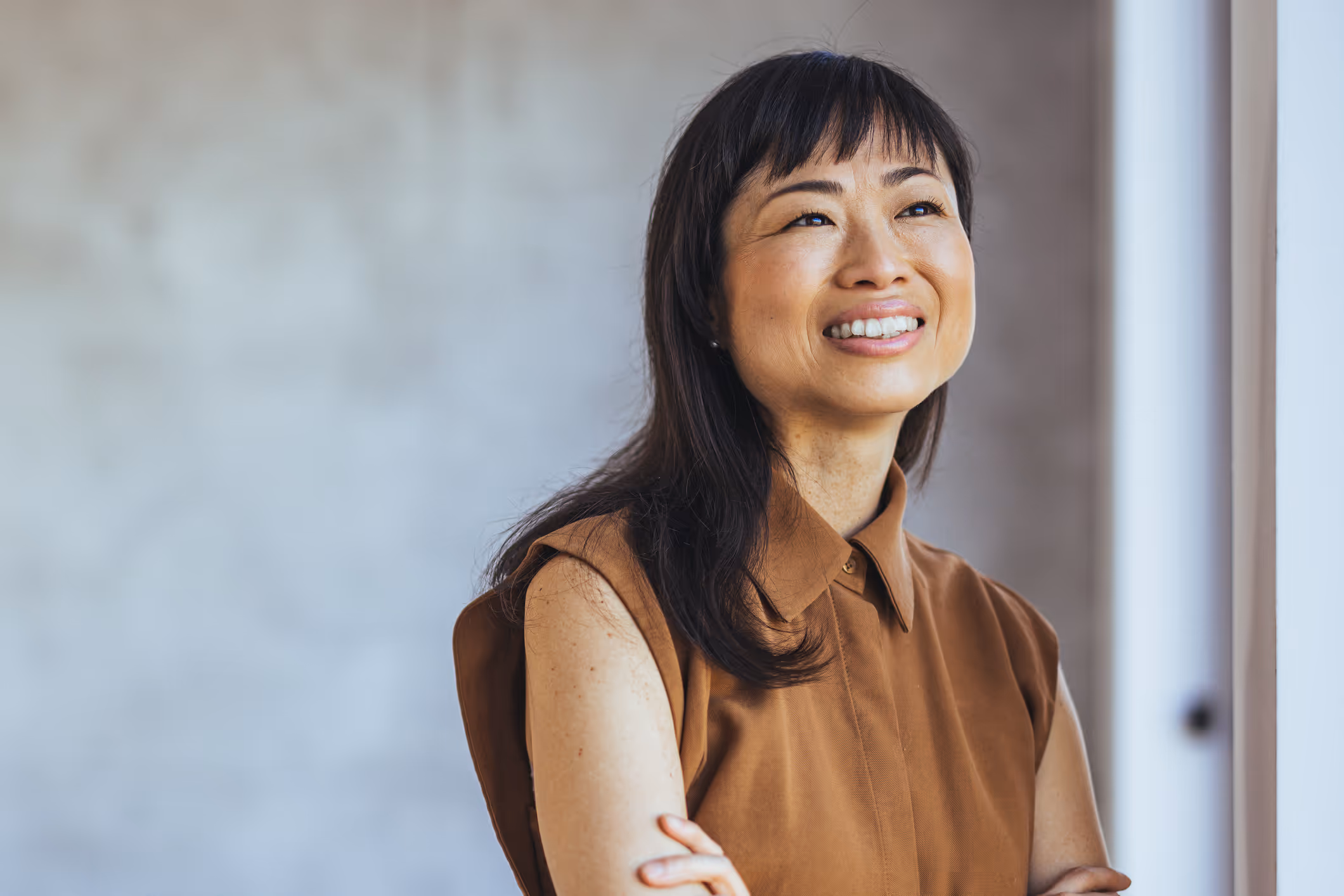 Smiling woman outdoors, confidently representing Hormone Therapy success.