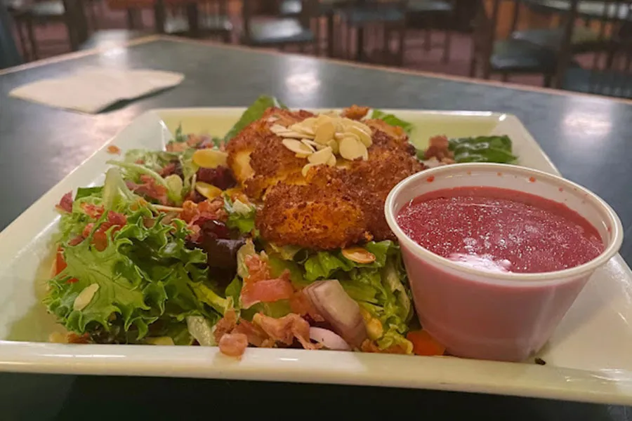 Fried chicken served with salad