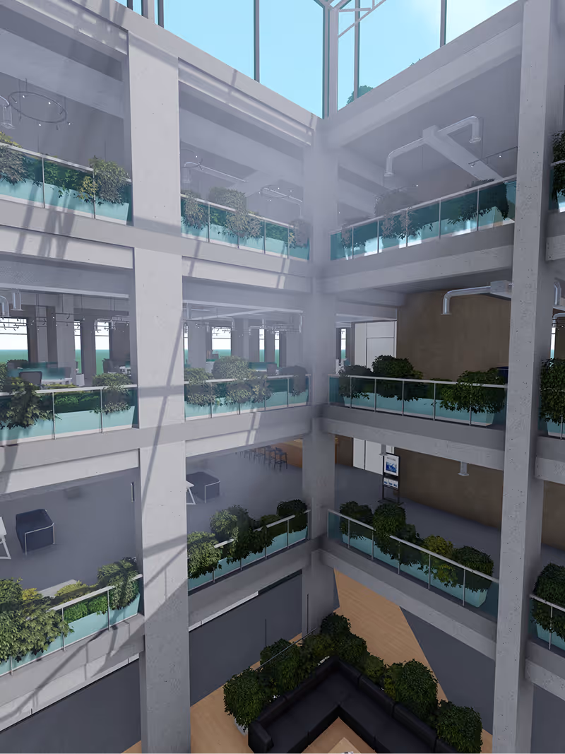 Interior view of a modern multi-story office atrium with glass railings, green plants, and natural light from skylights above.