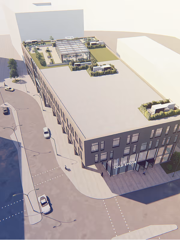 Aerial view of a modern, rectangular commercial building with rooftop gardens and the sign 'Cold Stone' above the entrance.