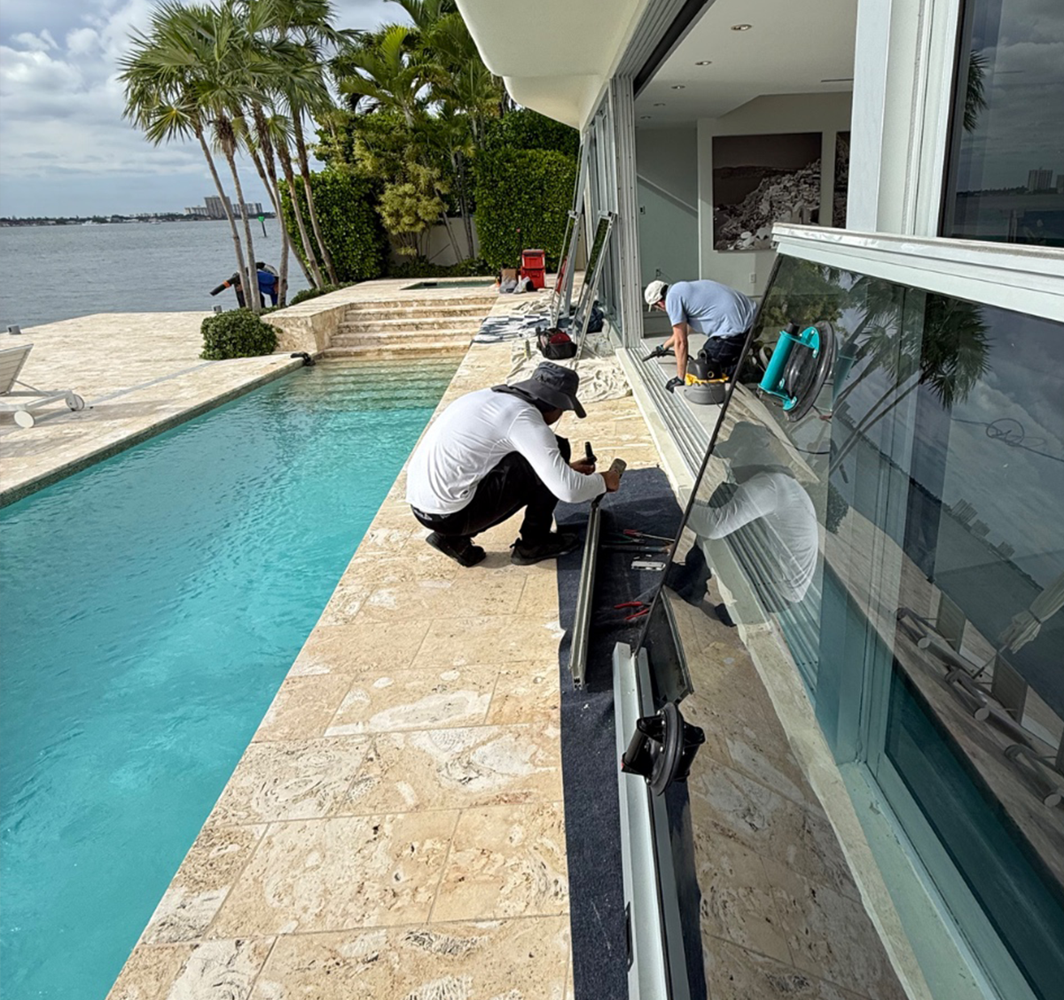 workers replacing a sliding door