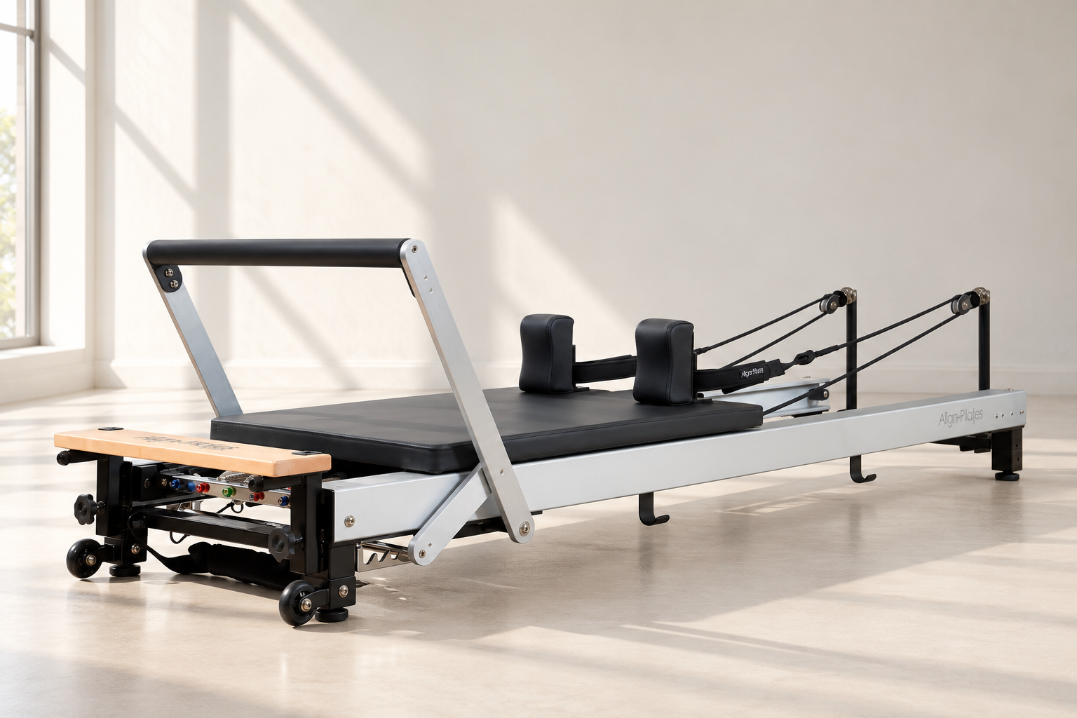 Align C8 Pro Reformer with a brushed silver frame, black carriage and footbar in a bright studio