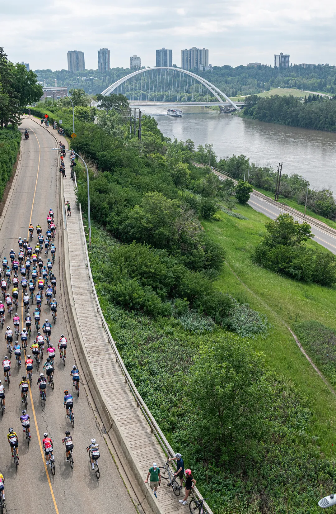 Bike race along the river in Edmonton with city in background