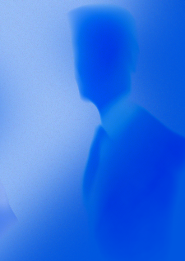 a man is staring in nothing. The style is blue and blurry