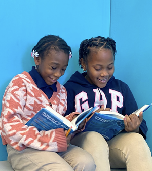 Two Girl kids reading book