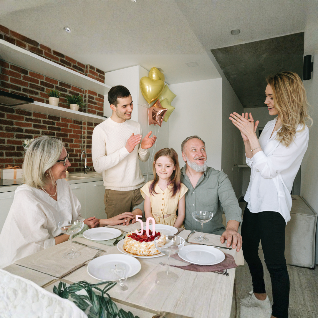 Image of a family with the grandfather celebrating his 50th birthday