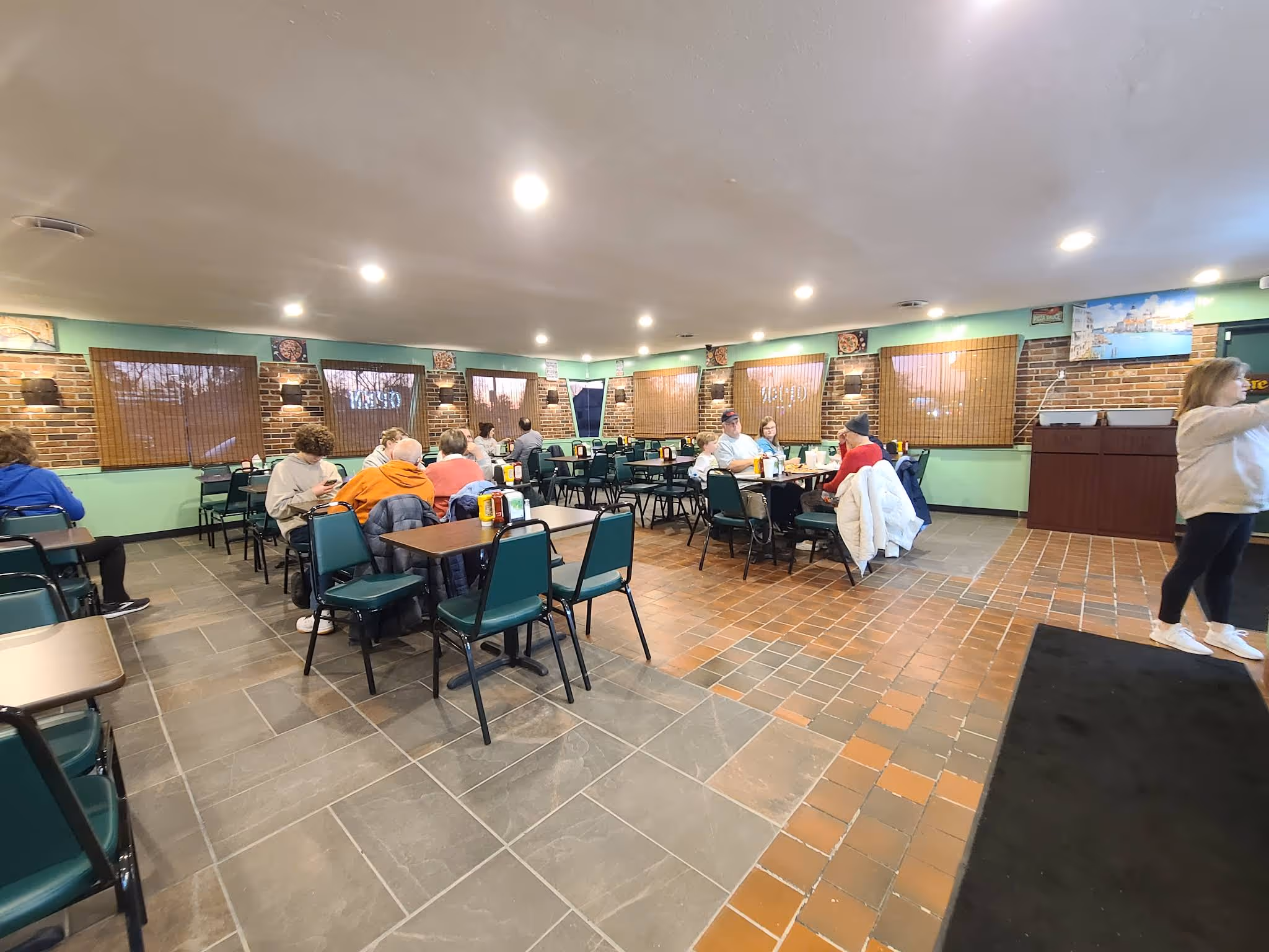 A restaurant with a green and white color scheme.