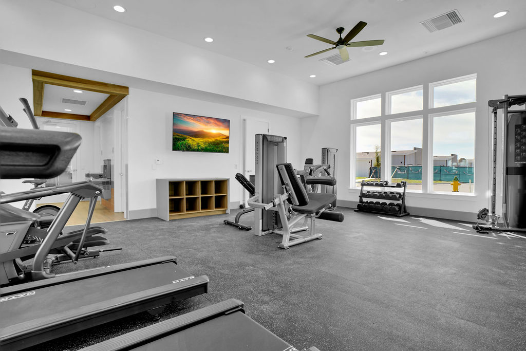 Community gym with cardio machines and strength machines