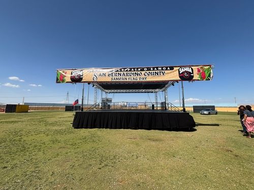 28 x 28 x 4 Steel Deck Stage with skirt, stairs and safety rail.