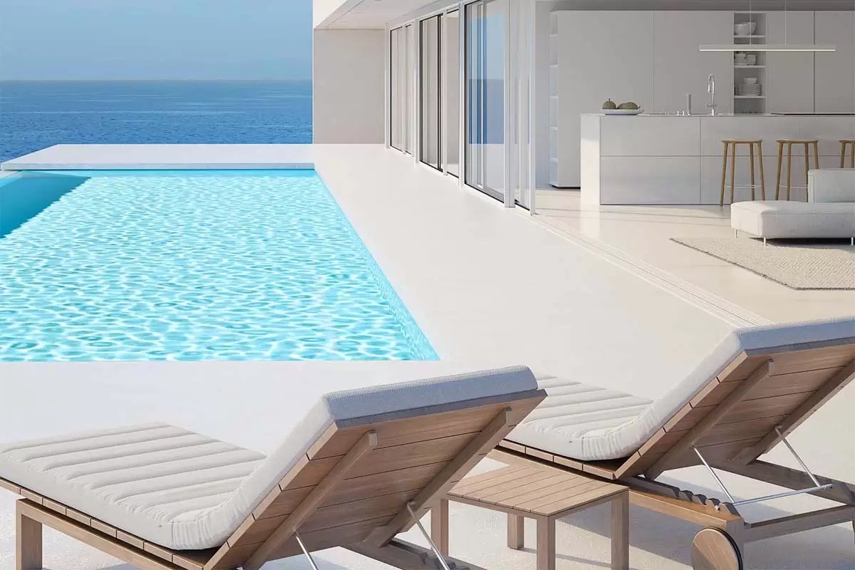 Luxury fibreglass pool with ocean views and white sun lounges