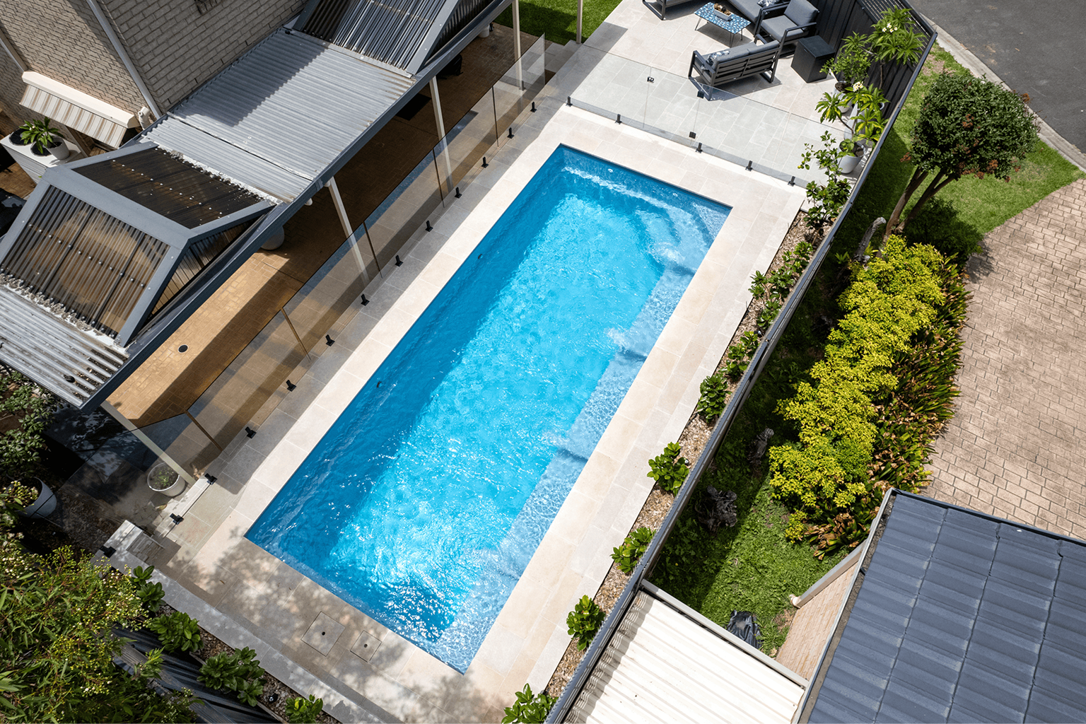 Aerial view of a completed fibreglass pool and pergola