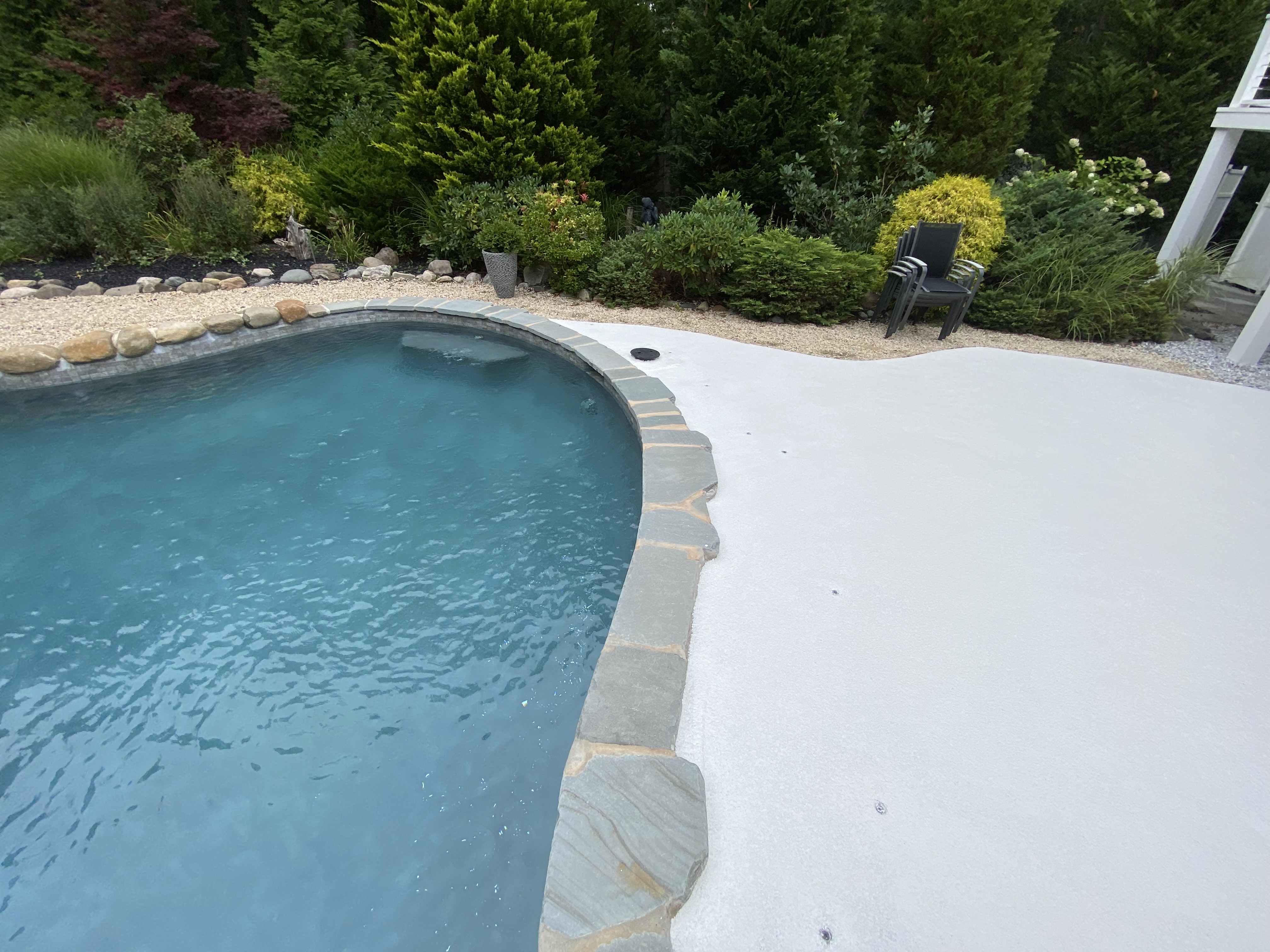 image of a white patio and pool finished with epoxy