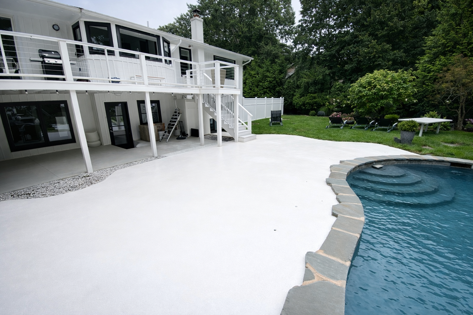 [background image] image of a pool and patio finished with white and blue epoxy