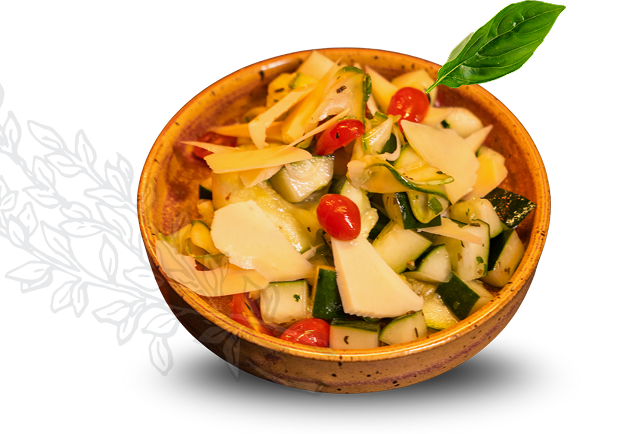 Salada de pepino, tomates cereja, lascas de queijo e folhas verdes em tigela marrom, decorada com folha de manjericão.