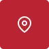 Ícone de marcador de localização branco sobre fundo vermelho.
