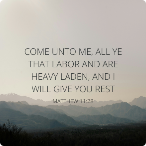Quote from Matthew 11:28 over a misty mountain landscape: 'Come unto me, all ye that labor and are heavy laden, and I will give you rest.'