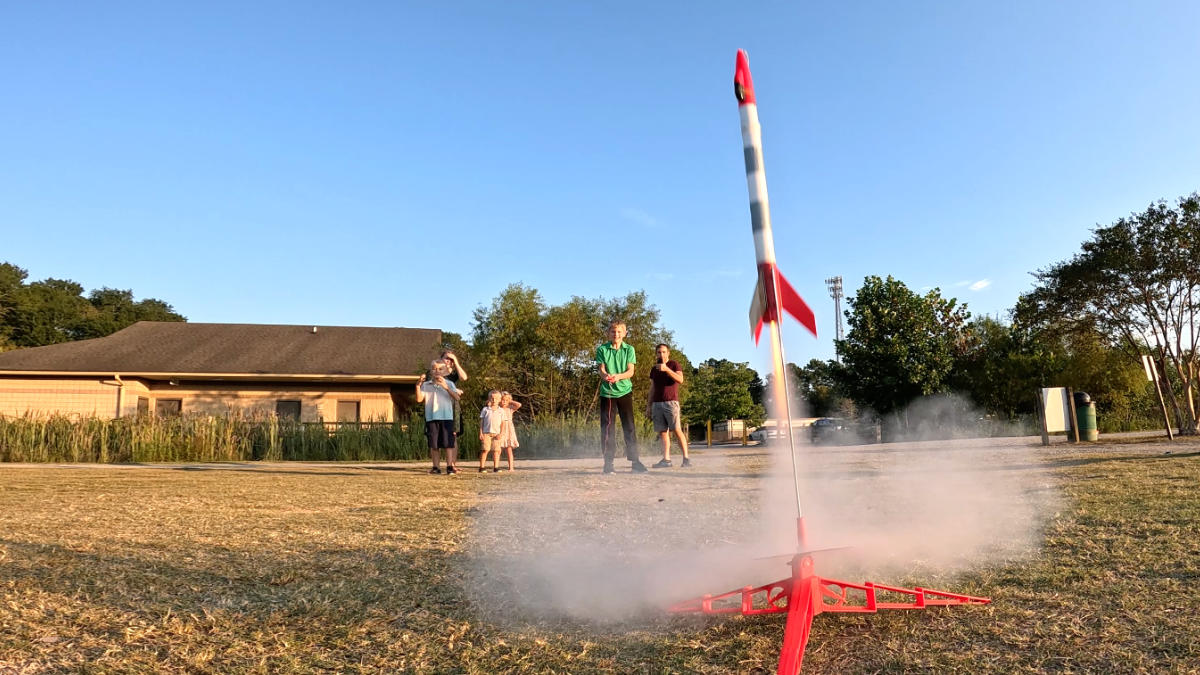 Estes rocket launches from pad