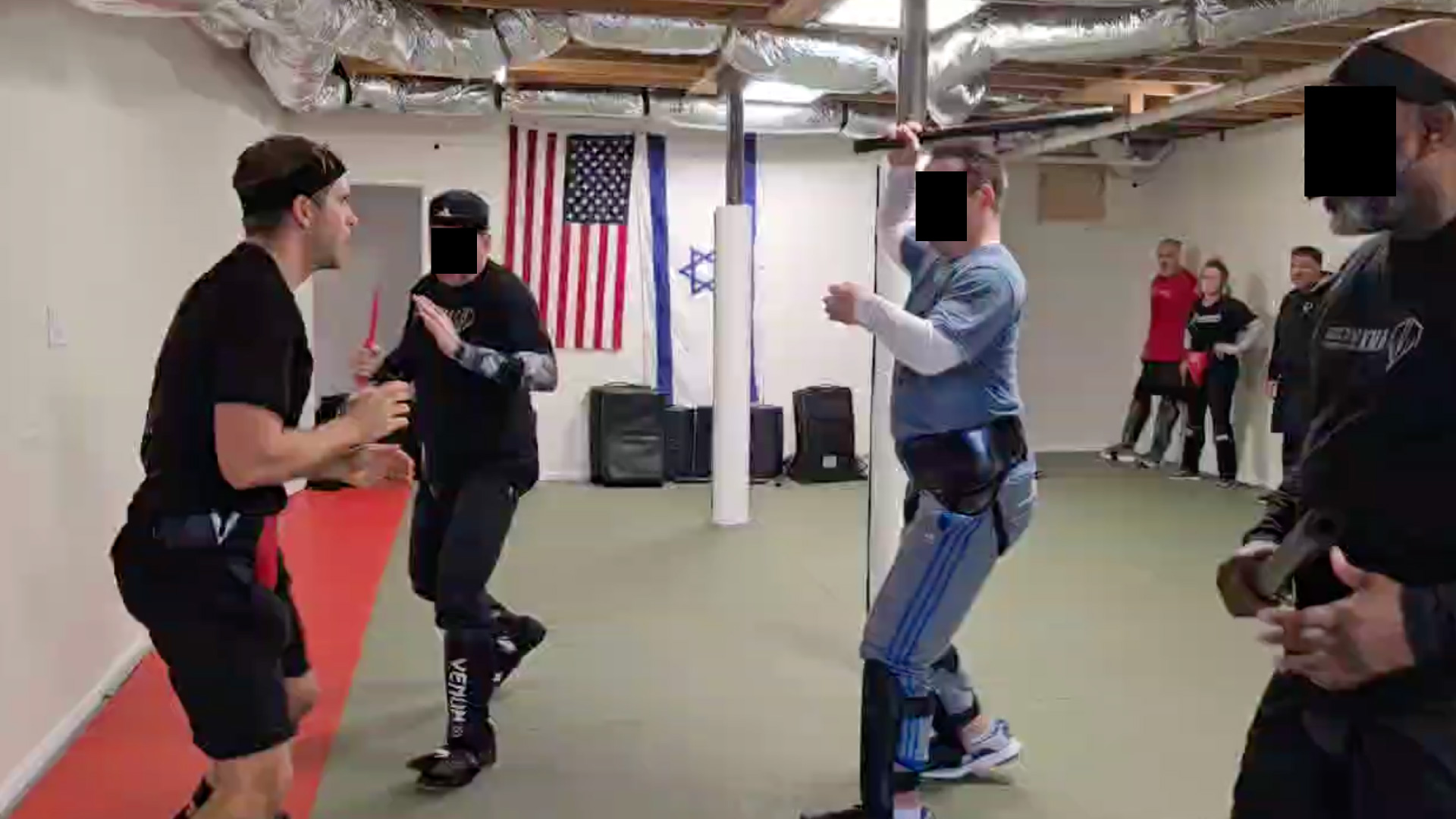A group of men practicing Krav Maga.
