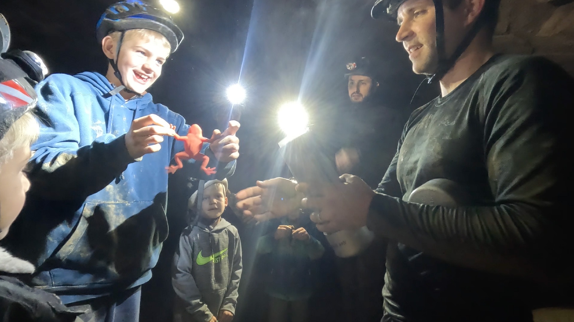 Boy prepares a time capsule in a cave chamber