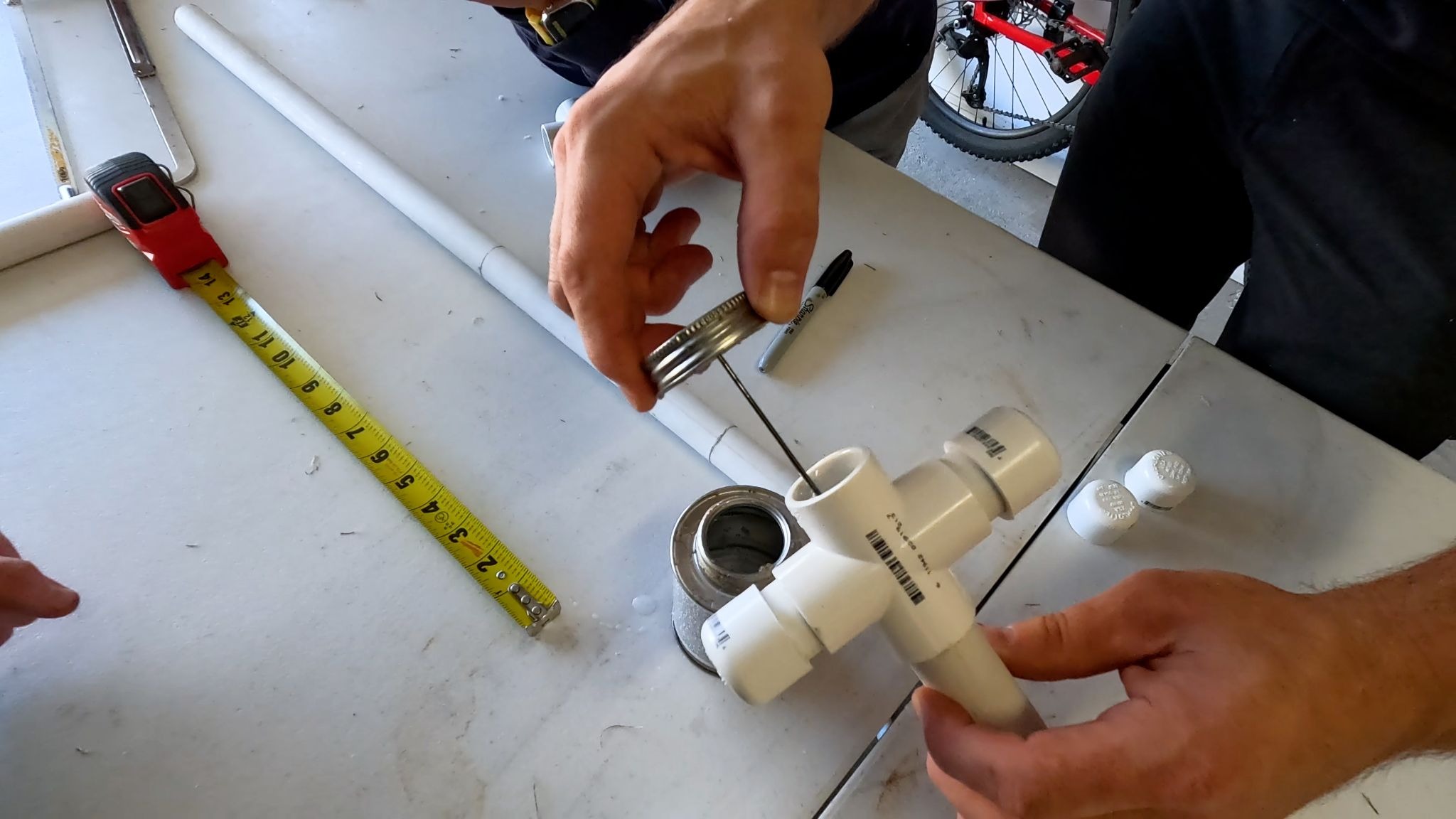 Man gluing PVC pipe