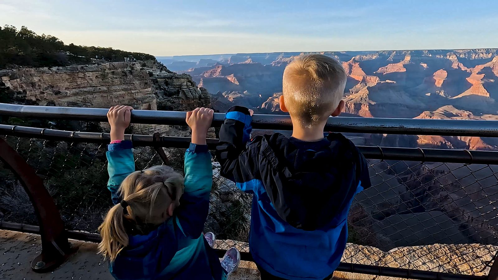 Two kids looking at Grand Canyon from Mather Point