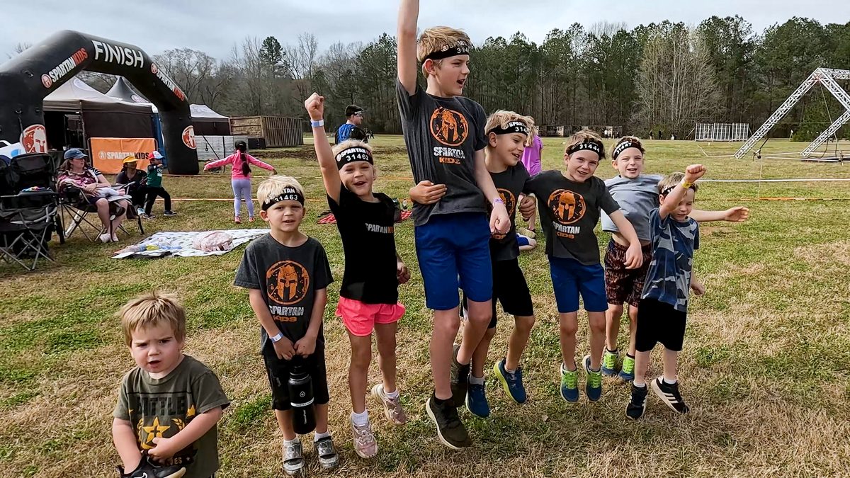 Kids jump and yell after Spartan race