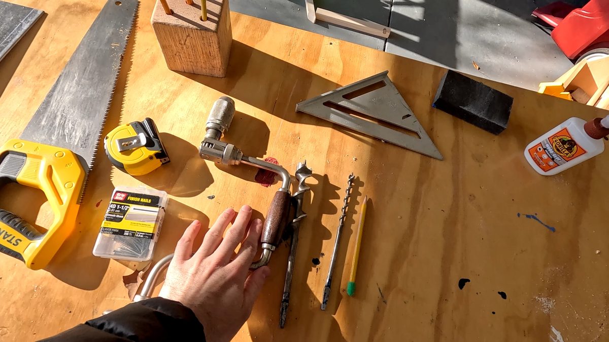 Tools are laid out on a work bench